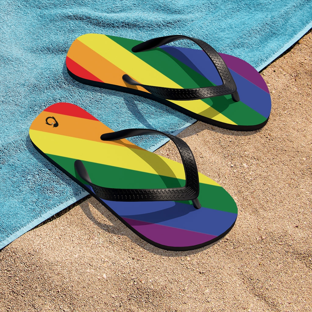 LGBTQ+ Rainbow Pride Flip-Flops - Black Straps - Rainbow Soles - On Beach Towel and Sand