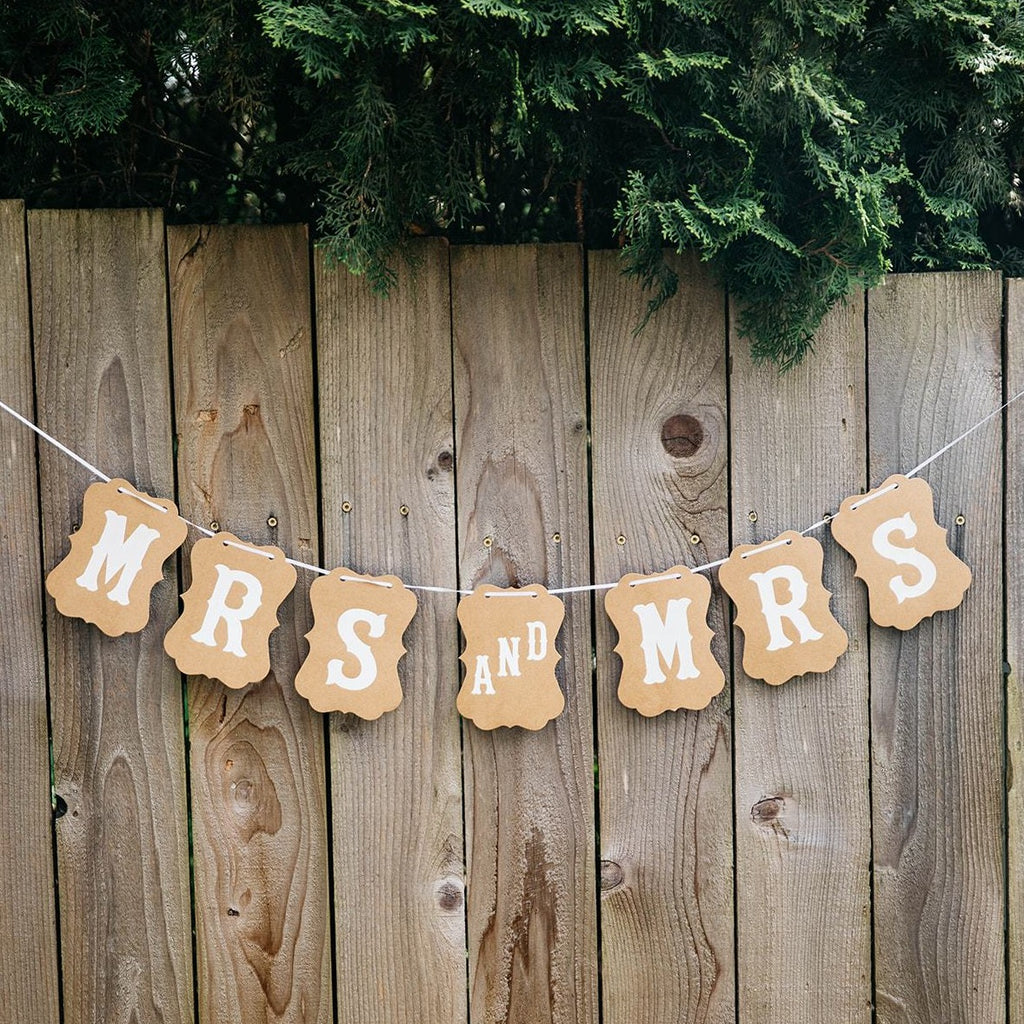 Mrs and Mrs Brown Craft Banner Hanging from Wooden Fence