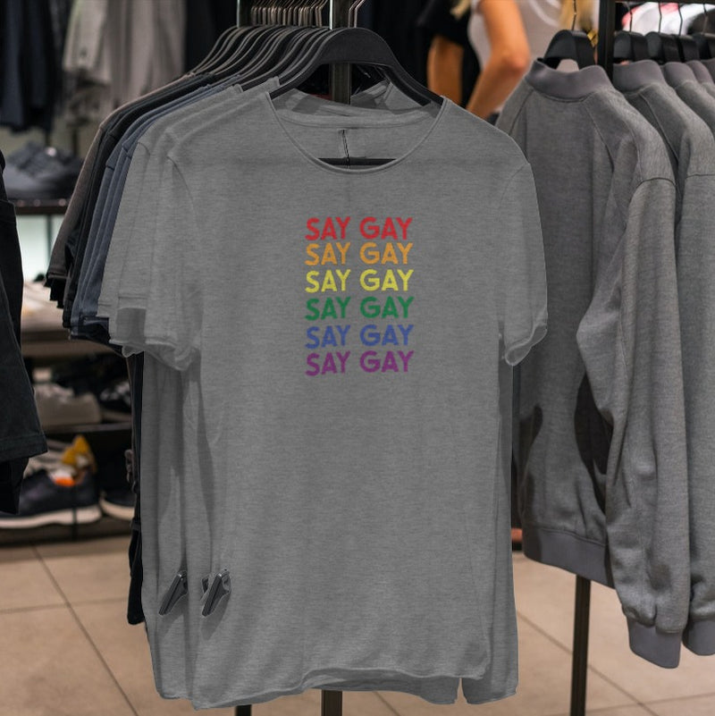 LGBTQ+ Pride Shirt - Say Gay  - Heather Grey shirts on hangers