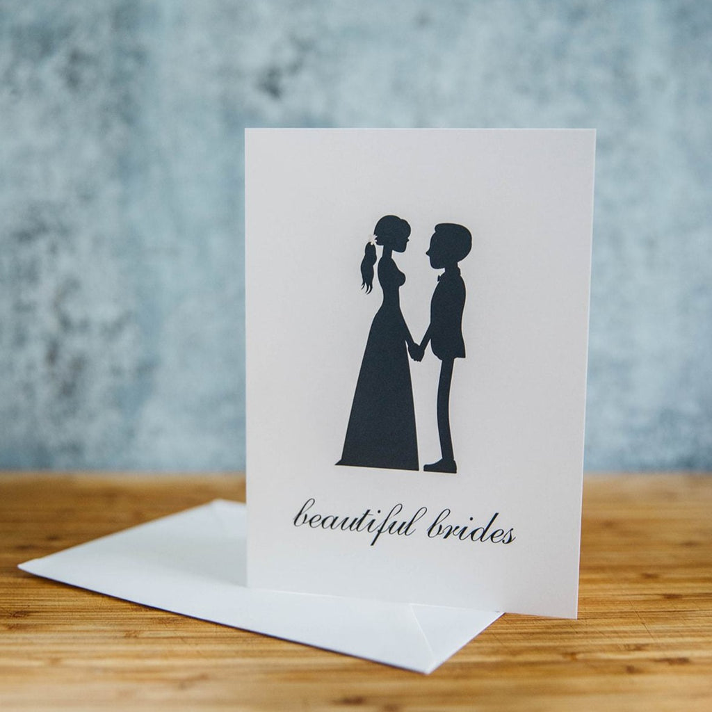 Black Silhouette of Two Beautiful Brides - One in Dress and One in Suit with Short Hair  - White Background - LGBTQ+ Greeting Card