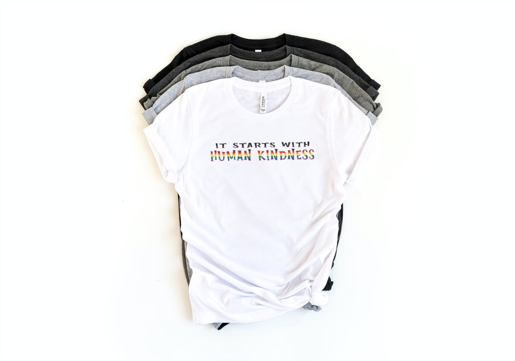 LGBTQ+ Pride Shirt - It Starts With Human Kindness - shirts in pile