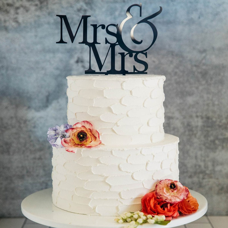 Lesbian Women's Mrs & Mrs Black Wedding Cake Topper On Top of White Cake