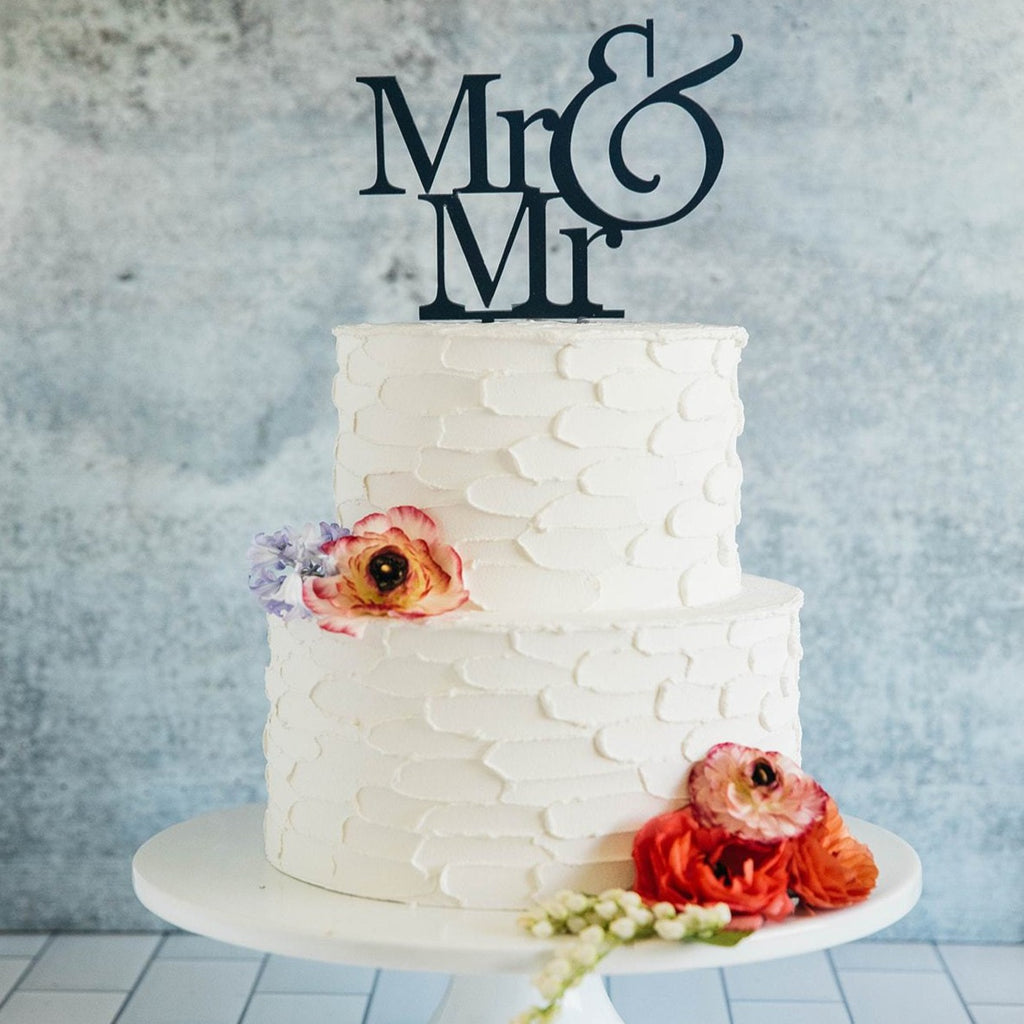 Gay Men's Mr & Mr Black Wedding Cake Topper On Top of White Cake 