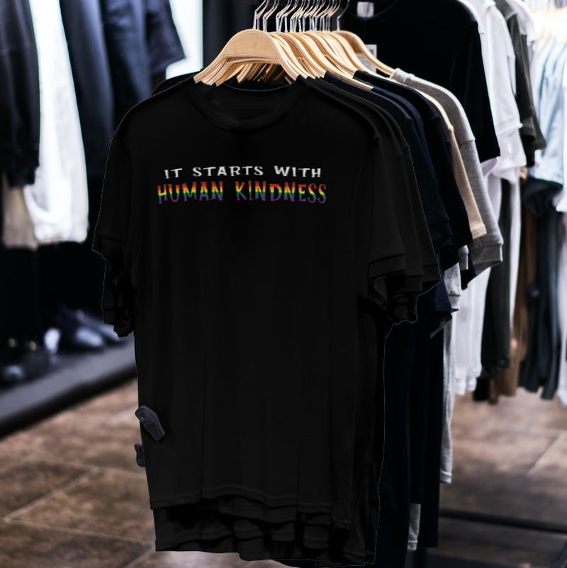 LGBTQ+ Pride Shirt - It Starts With Human Kindness - Black shirts on hangers