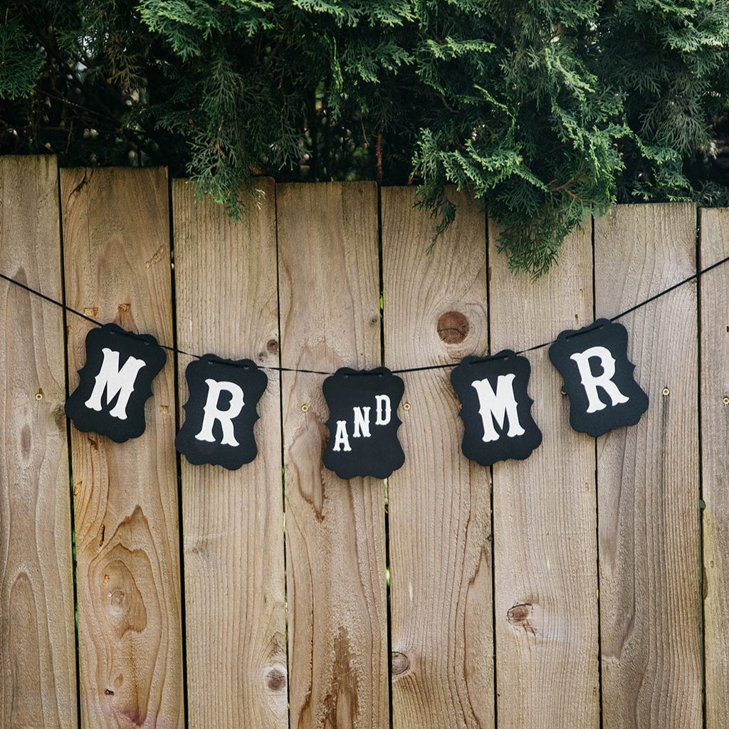 Mr and Mr Black Craft Banner Hanging from Wooden Fence