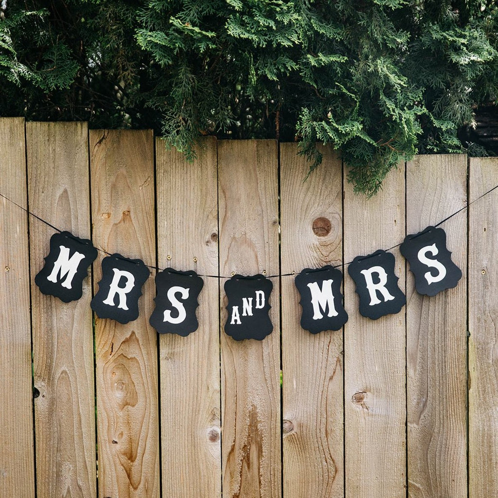 Mrs and Mrs Black Craft Banner Hanging from Wooden Fence